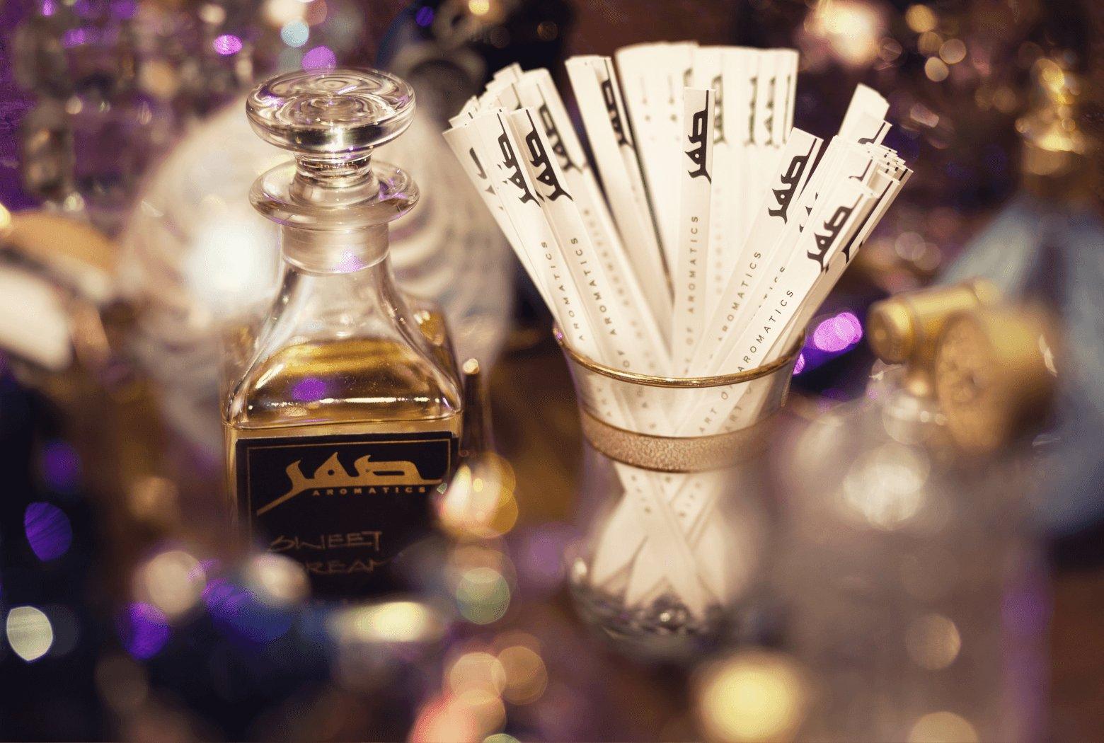 Sifr Aromatics perfume oil bottle and fan of Sifr Aromatics blotting cards, Singapore