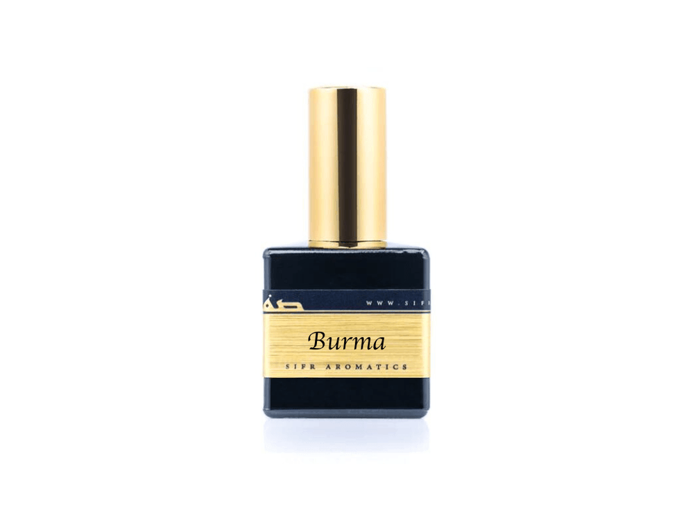 50ml spray bottle of Eau De Parfum placed elegantly on a white background. The bottle is sleek and black, with a polished gold cap. The label on the bottle is designed in gold and black, featuring Sifr Aromatics' logo and the perfume name 'Burma.' The overall aesthetic is clean and sophisticated, highlighting the high-quality craftsmanship of the product