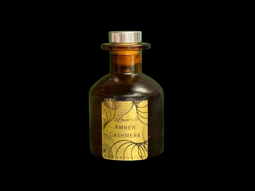 Sifr Aromatics 100ml Amber Cashmere diffuser oil in a brown glass bottle, warm cocooning notes of amber and tonka