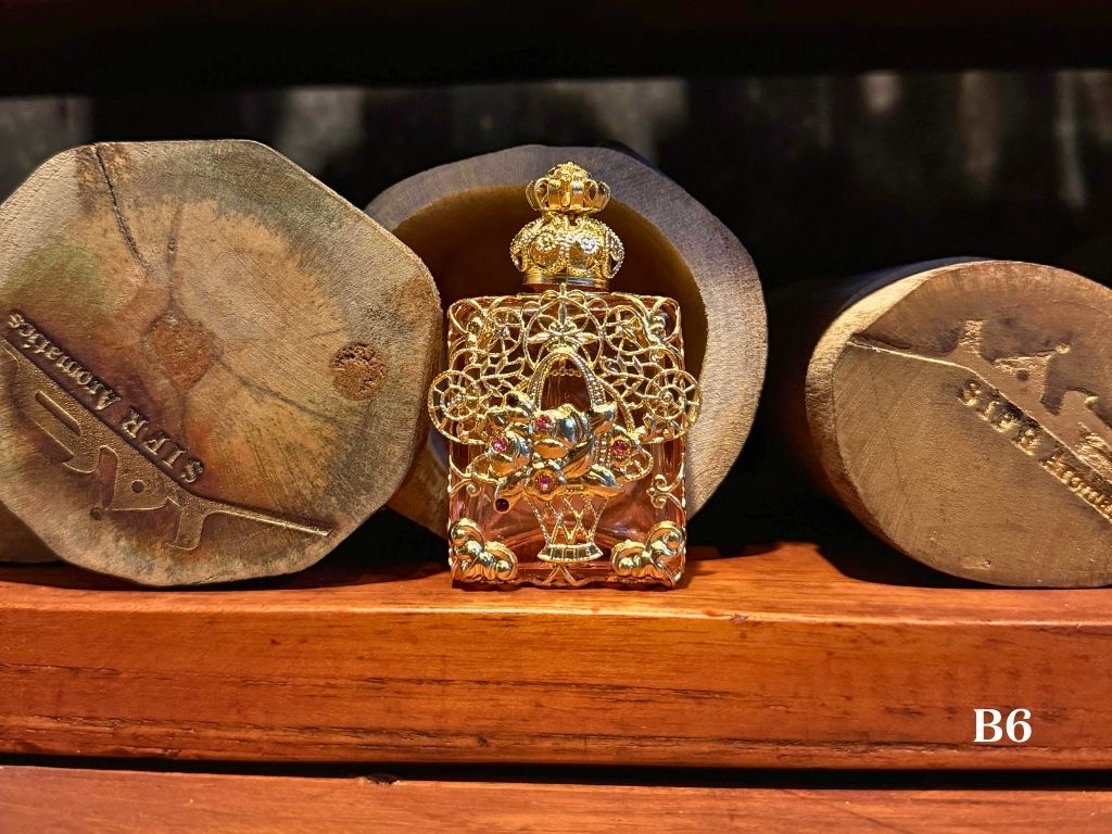 Light pink oil perfume decorative bottle with handmade metalwork from Czech Republic 