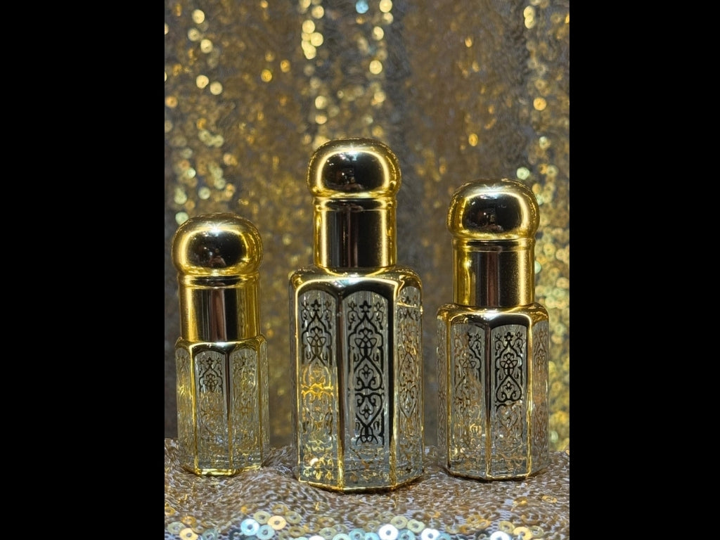 Pure Cambodian oud oil in luxurious gold bottles, sustainably farmed and ethically sourced, available in three sizes, showcasing Sifr Aromatics’ premium natural oud fragrance