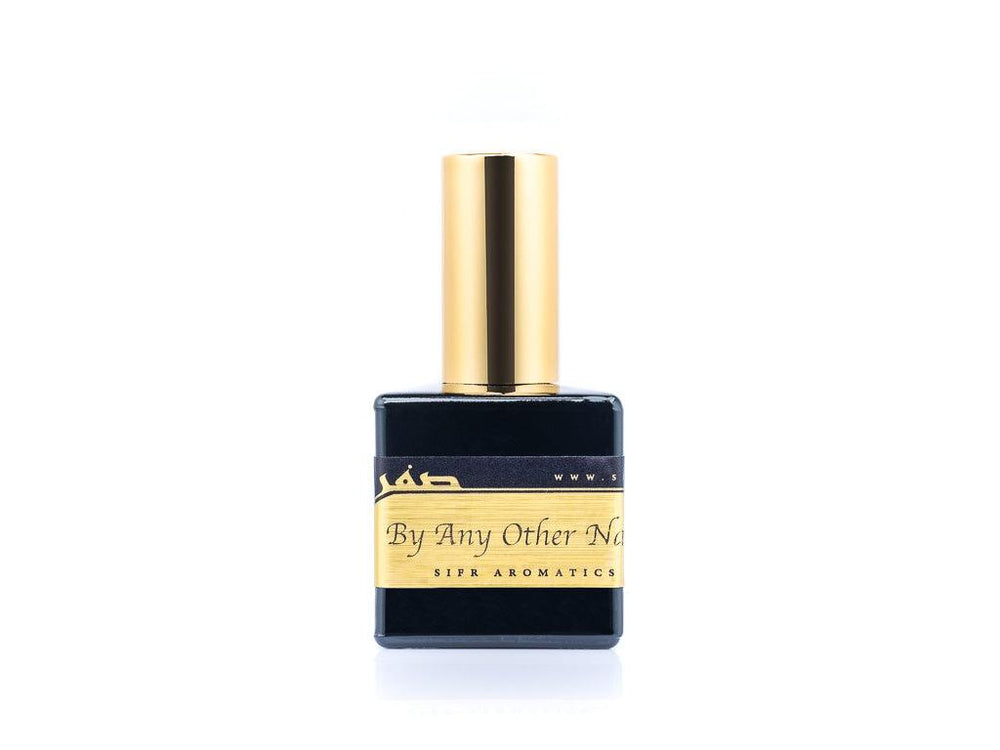 50ml spray bottle of Eau De Parfum placed elegantly on a white background. The bottle is sleek and black, with a polished gold cap. The label on the bottle is designed in gold and black, featuring Sifr Aromatics' logo and the perfume name 'By Any Other Name' The overall aesthetic is clean and sophisticated, highlighting the high-quality craftsmanship of the product